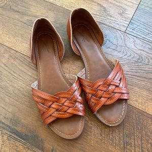 Brown leather huarache sandals.